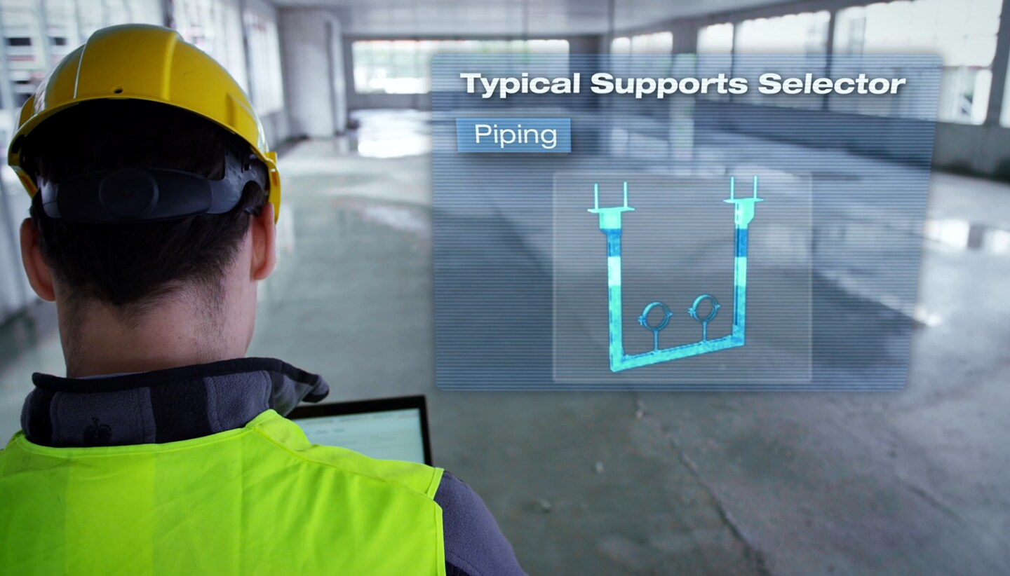 Customer on jobsite selecting material with MEP Support Selector on tablet