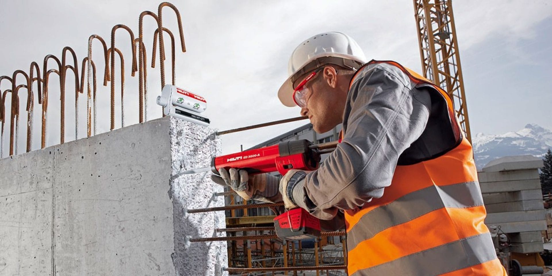 Worker using the HDE 500-A22 to install chemical anchor